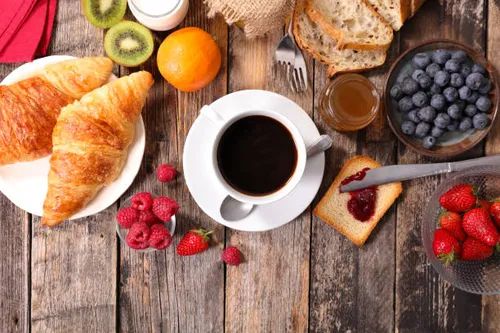 breakfast-with-coffee-croissant-and-fruits