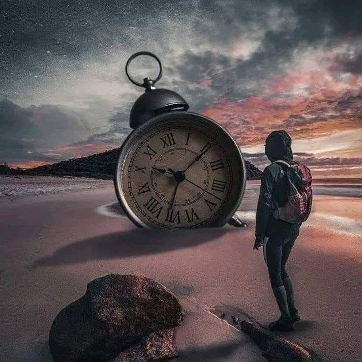 Clock on the sandy beach