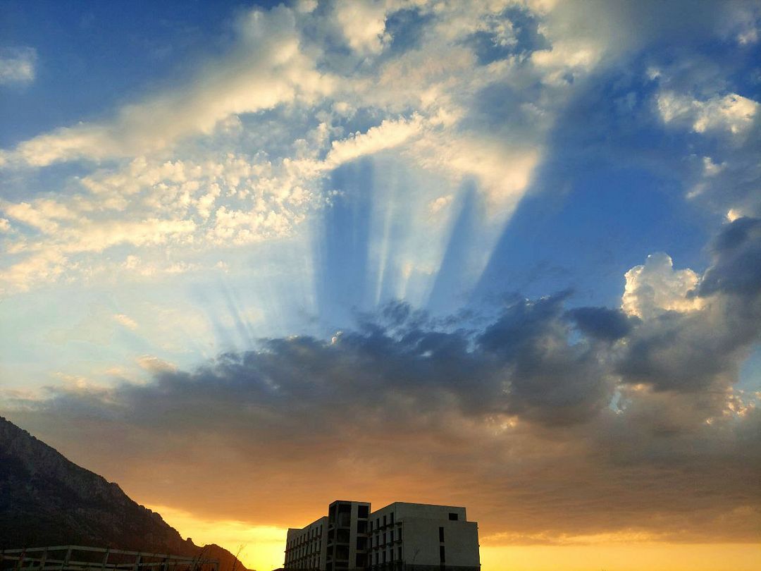 sunlight leaking through clouds