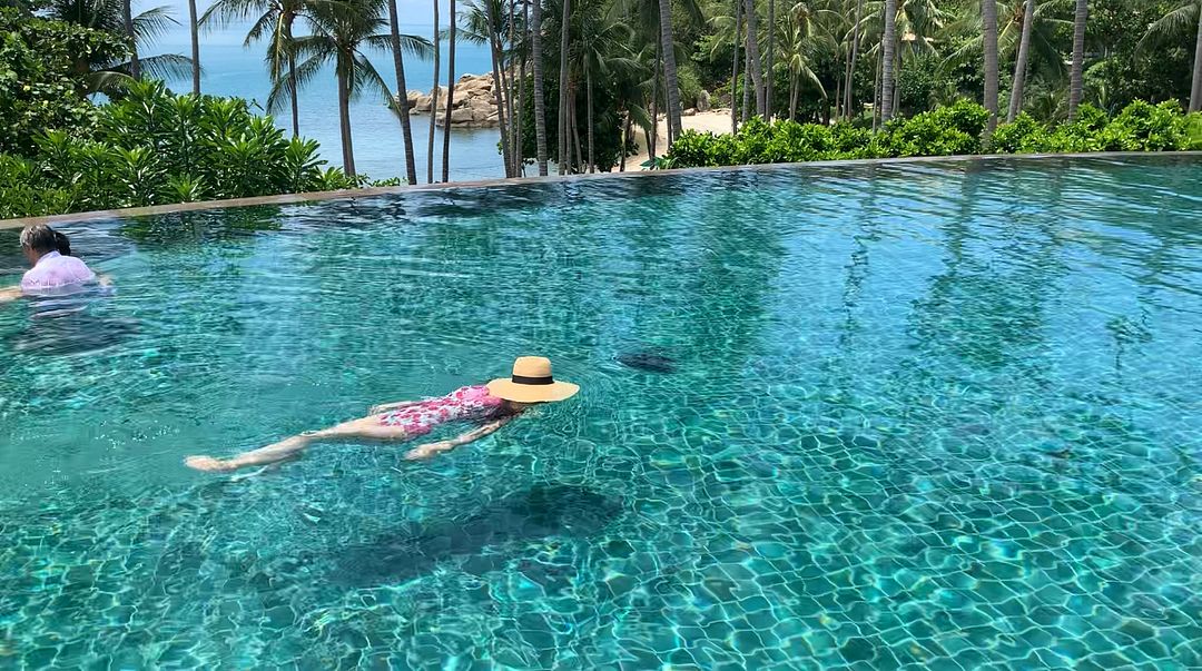 shasha swimming on a small island