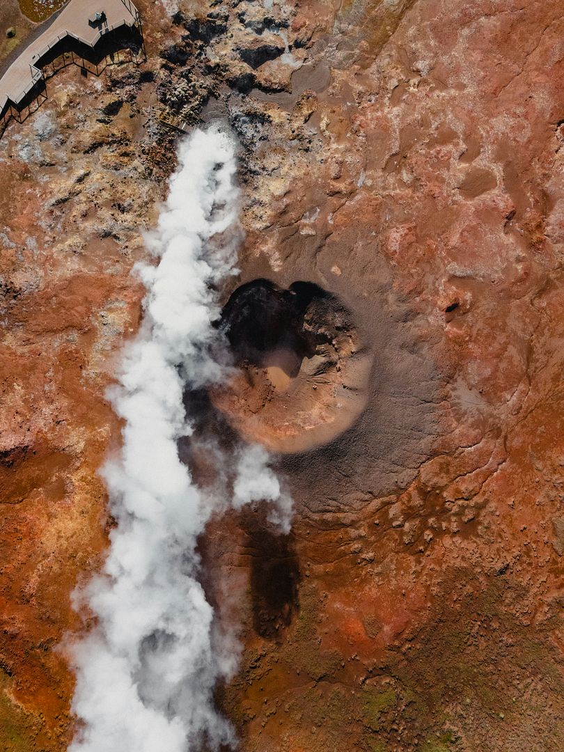 an aerial view of a large pipe coming out of the ground