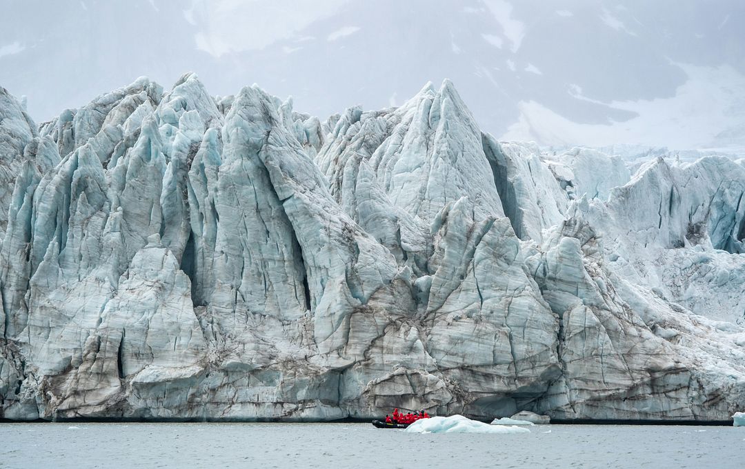 a large iceberg in the middle of a body of water