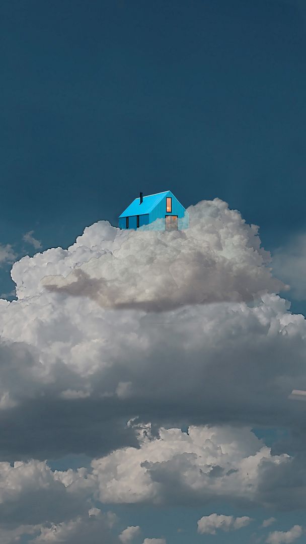 Blue house standing on a cloud