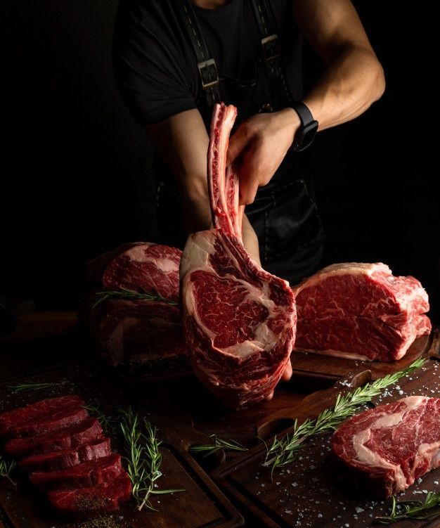 Premium Photo _ Butcher showing rack of ribs_