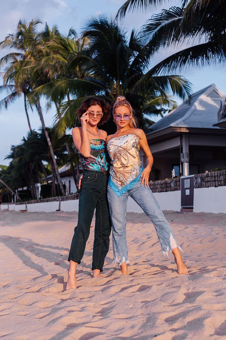 two-happy-woman-friends-with-sunglasses-vacation-tropical-country