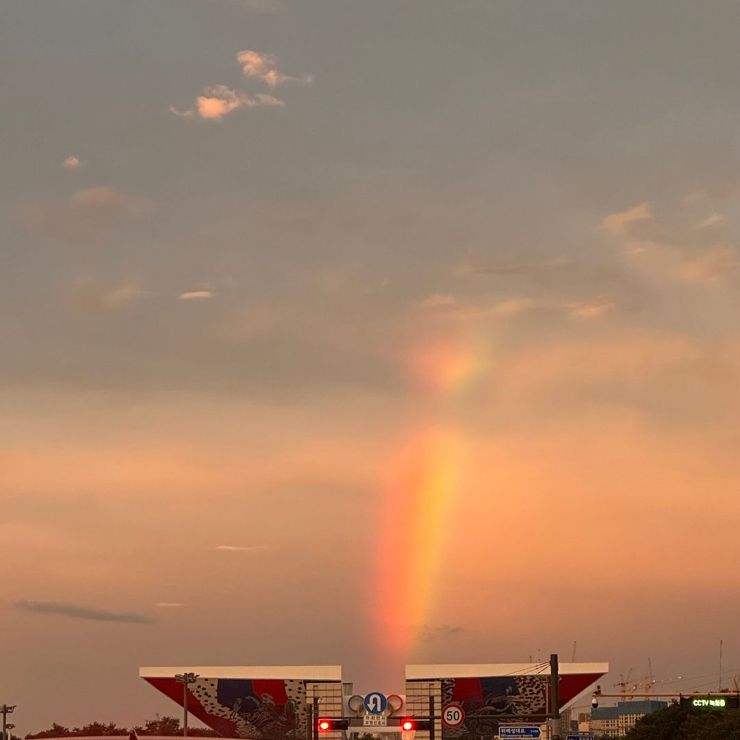 a rainbow at sunset