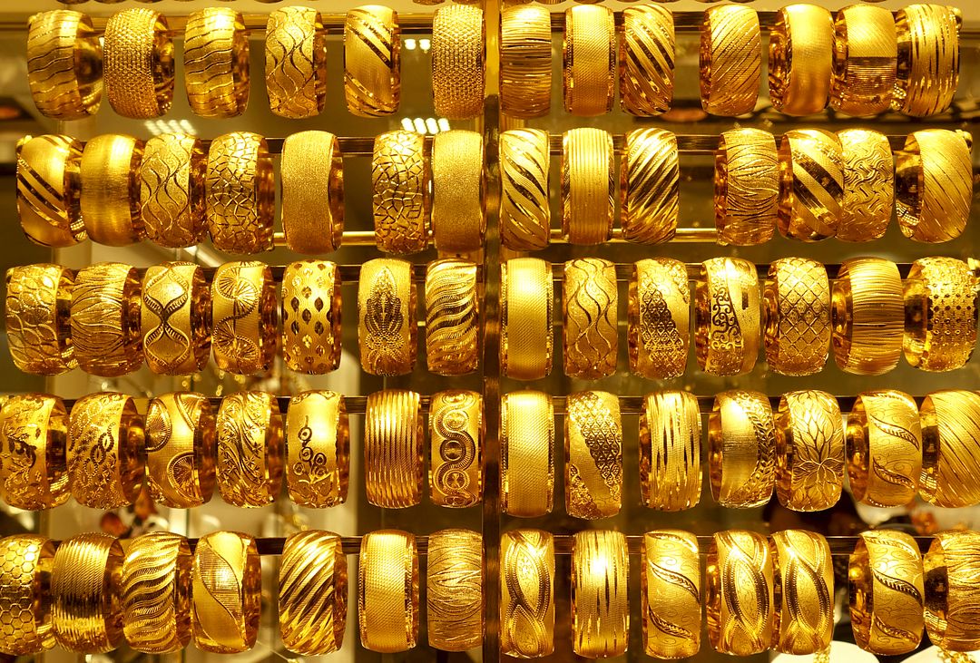 Gold bracelets background