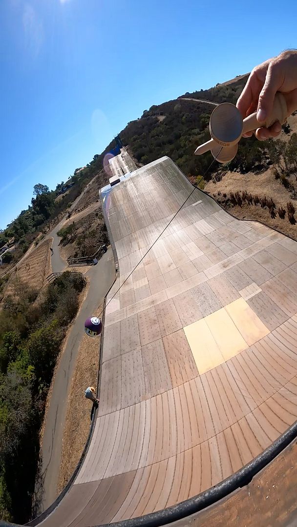 Tré flipping the Nouns kendama on Bob Burnquists Mega Ramp