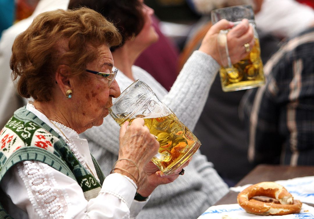 older person drinking beer