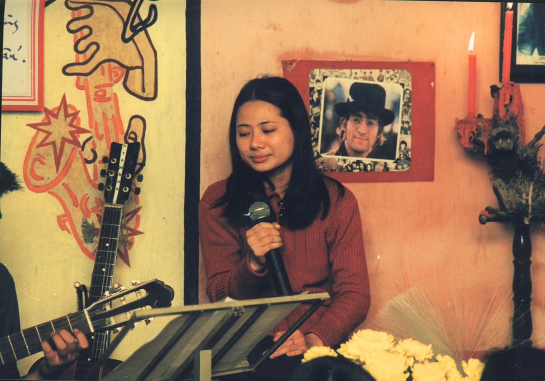 Singing at a hidden cafe in Hanoi, Vietnam 2001