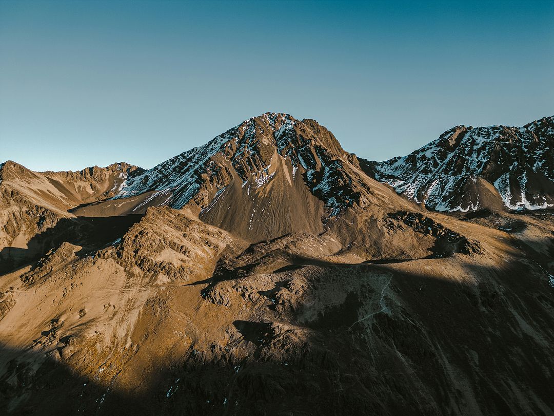 a group of mountains with snow on them