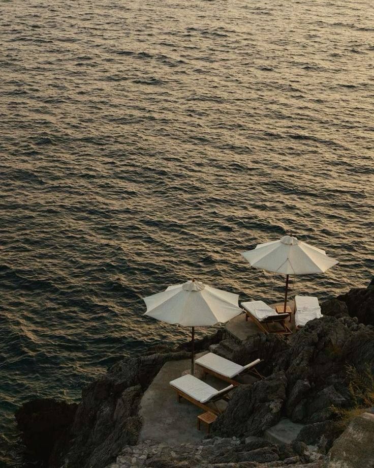 sun loungers by the cliff