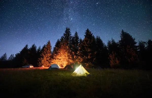 A glowing campfire under the stars