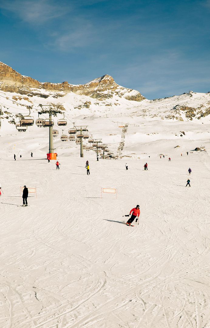 Skiers on the Slope with a Ski Lift