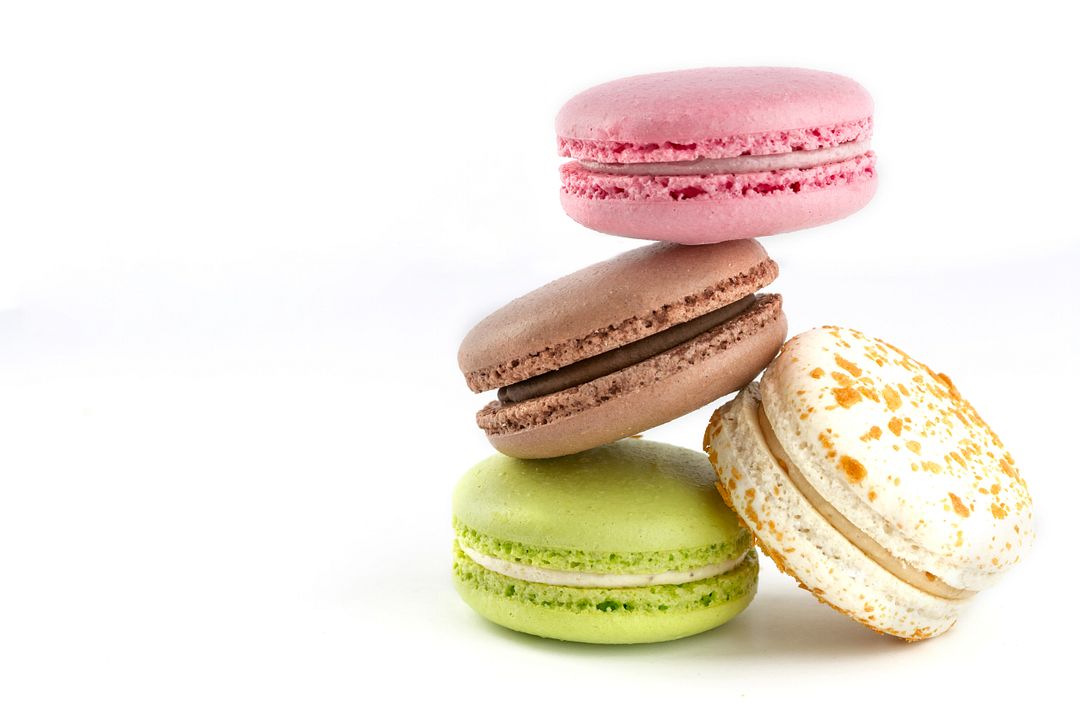 Colorful macaroons on white background