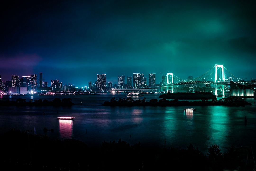 We were having a BBQ on a rooftop while it was pouring rain and while we got extremely wet, I was lucky enough to get some beautiful photos of the city’s glow and everyone still had fun.