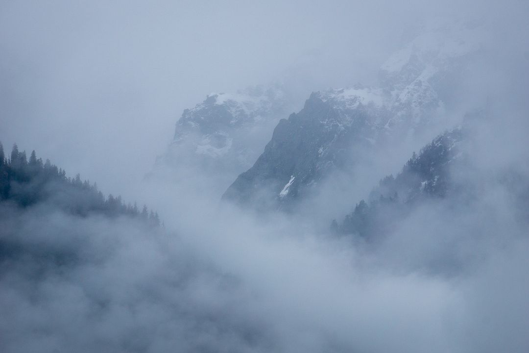 Mountains Covered in Snow and Fog.