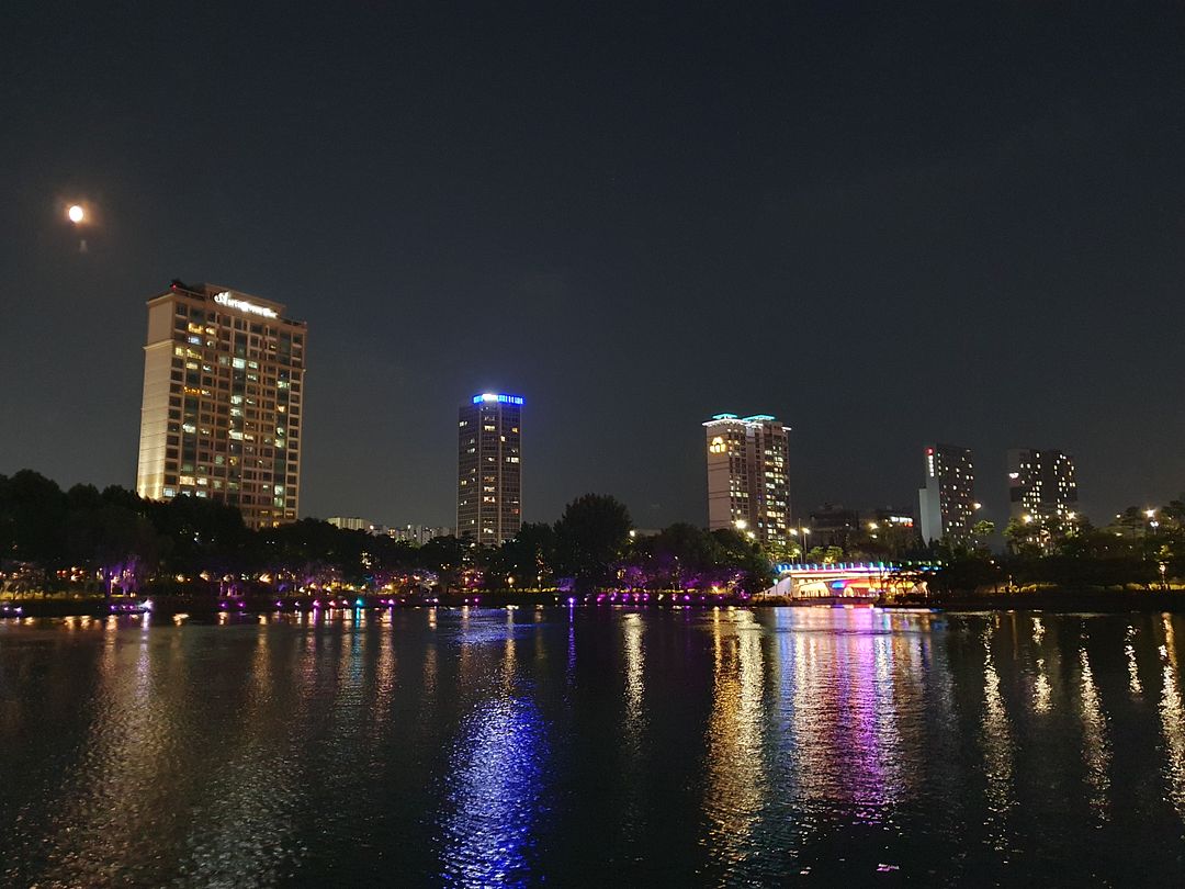 the night view of a city lake