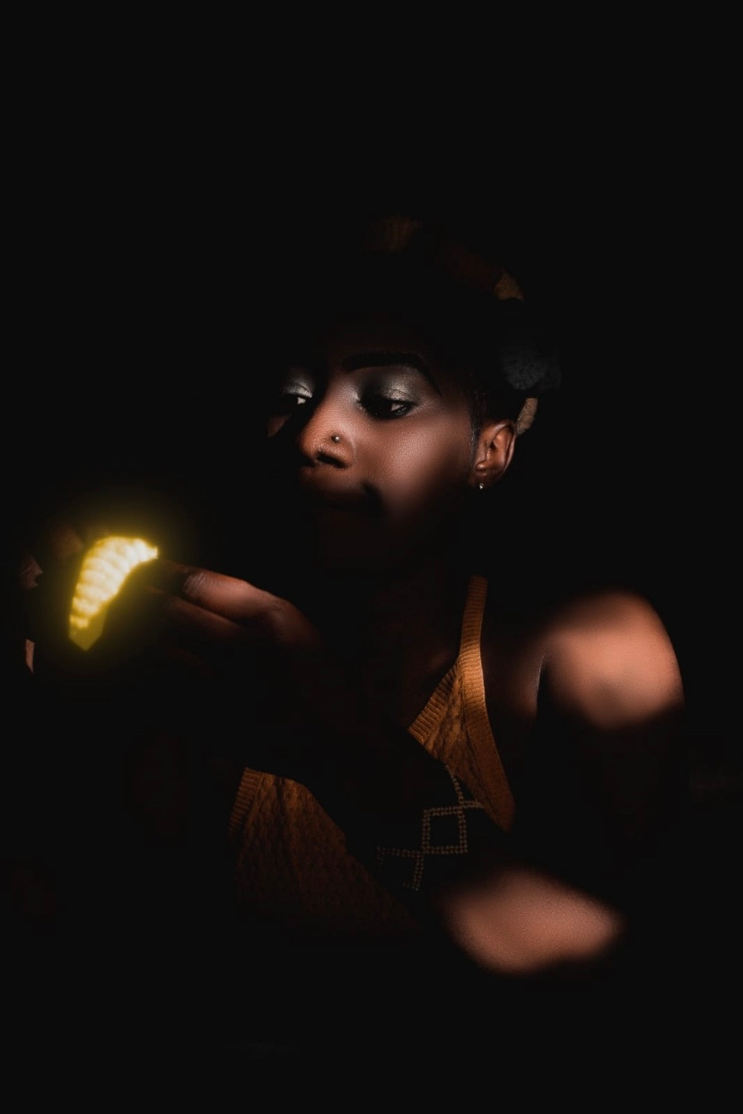 In the depths of darkness, she cradles a fragile light, a flicker of hope amidst the shadows. Like fireflies in the night, our dreams guide us through life’s obscurity, reminding us that even in our darkest moments, we carry the power to illuminate our own path. ‘Photography by Johnson JB’